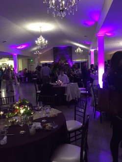 Holly Field Manor's reception hall lit up with dancing and a DJ.